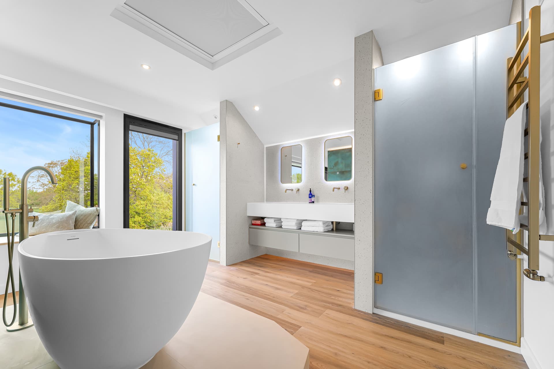 Bathrooms — Three bathrooms. One standard across all of them.